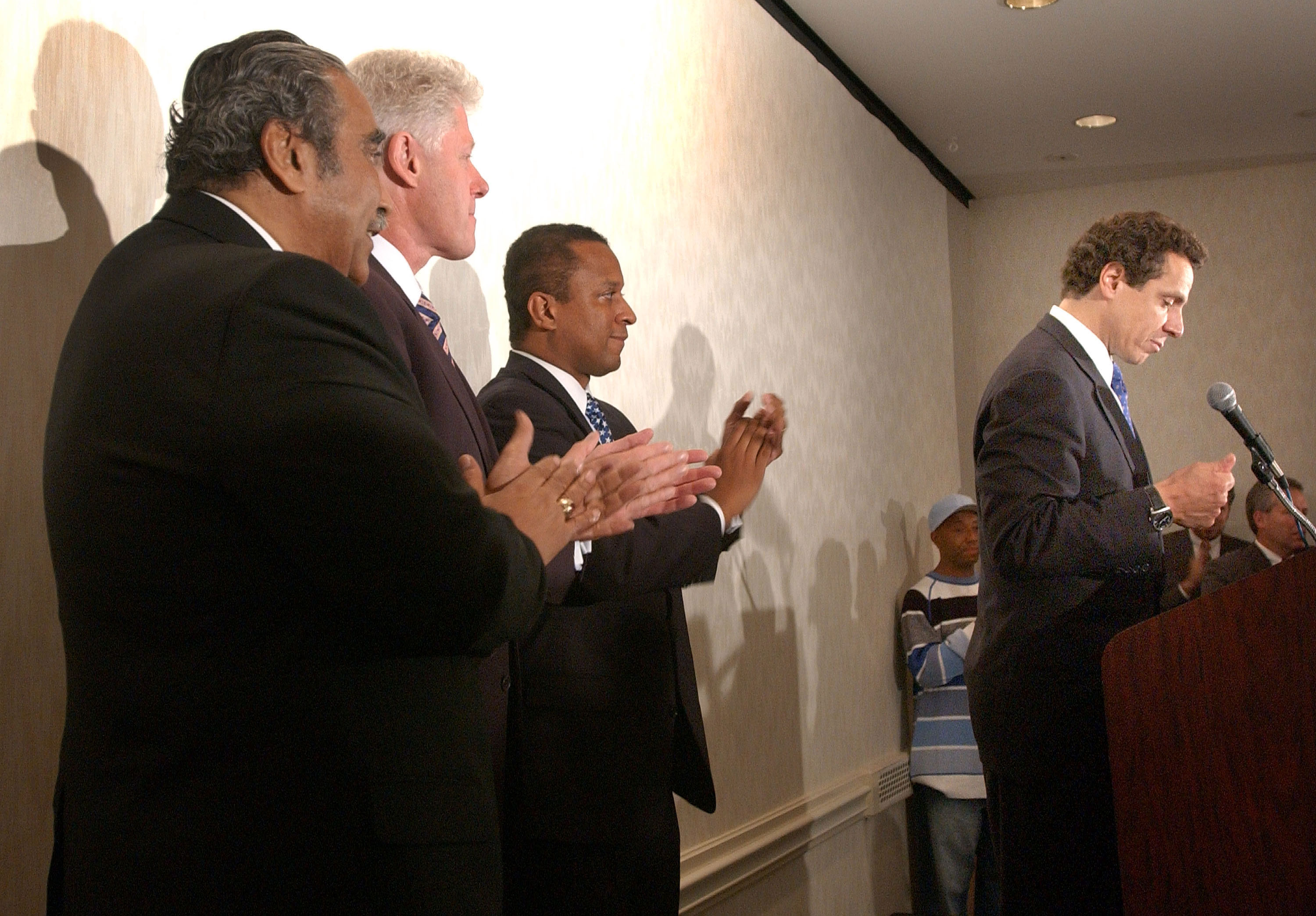 Charlie King, center, joins former President Bill Clinton and then-Rep. Charlie Rangel as Cuomo announces he’s suspending his campaign for governor in 2002.