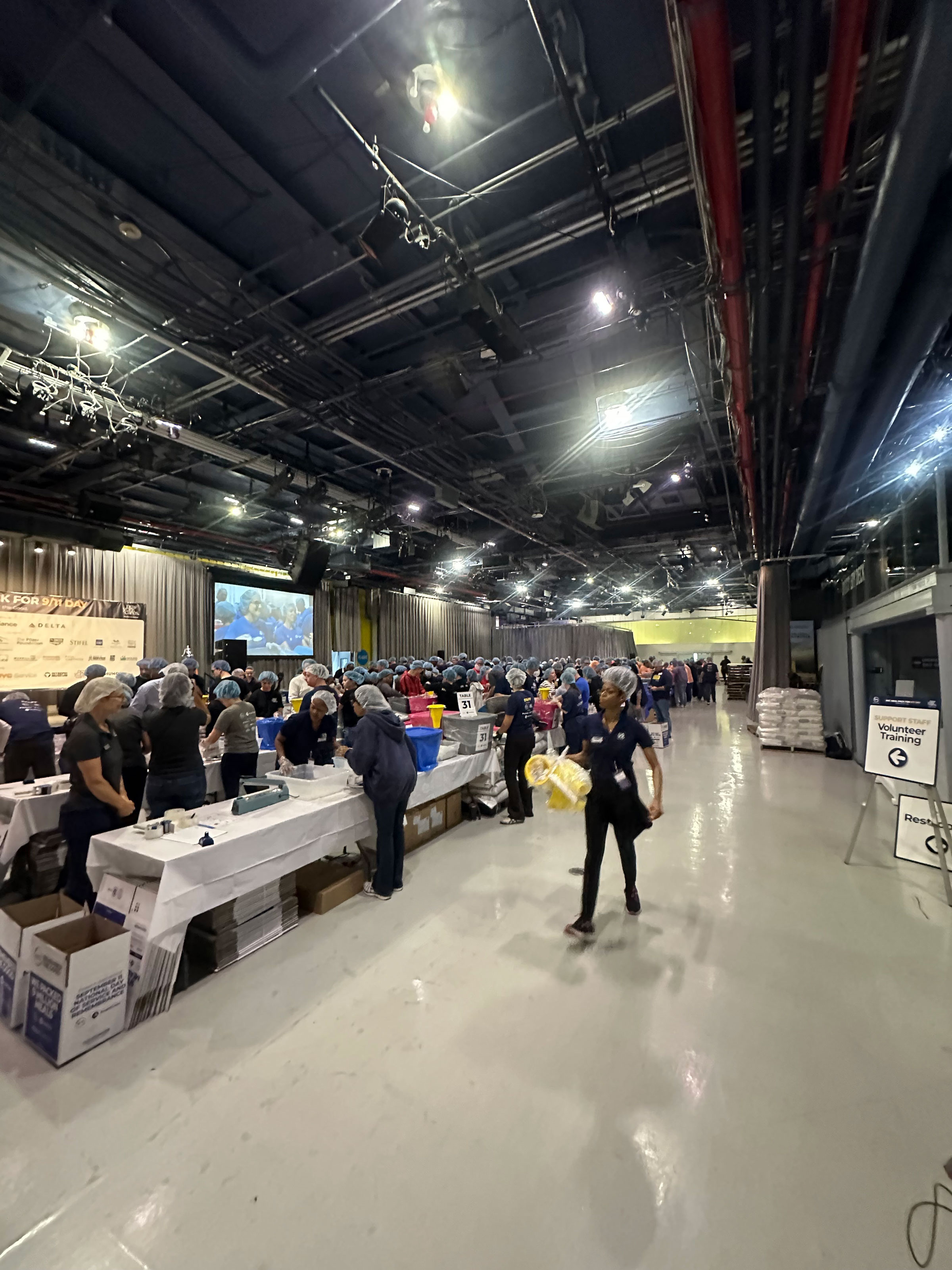 Volunteers packing nonperishable meals as part of 9/11 Day at the Intrepid Museum on Sept. 10, 2025.