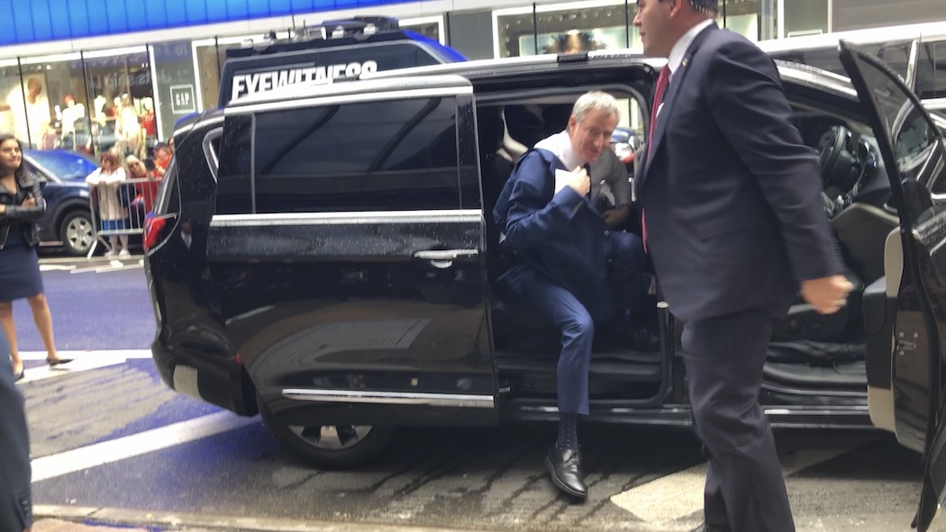 Mayor de Blasio exiting his chauffeured car.