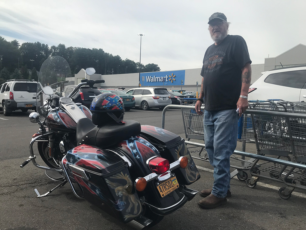 Outside a Wal-Mart in Binghamton, resident Stephen Griffin says the Confederate flag stands for "freedom" and that "they ought to let [Trump] run the country."