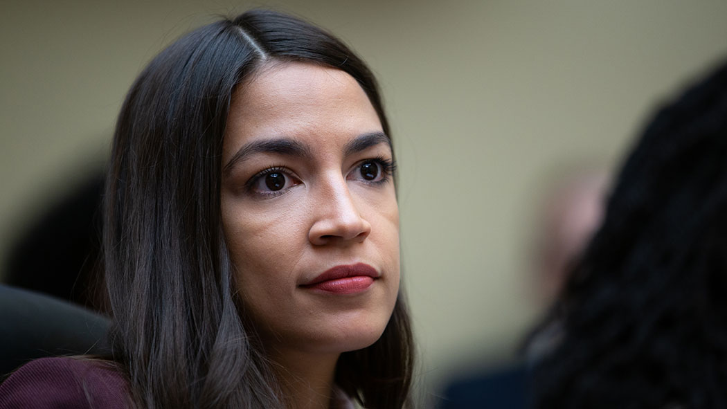 Rep. Alexandria Ocasio-Cortez listens to witnesses in a House Oversight Committee hearing.