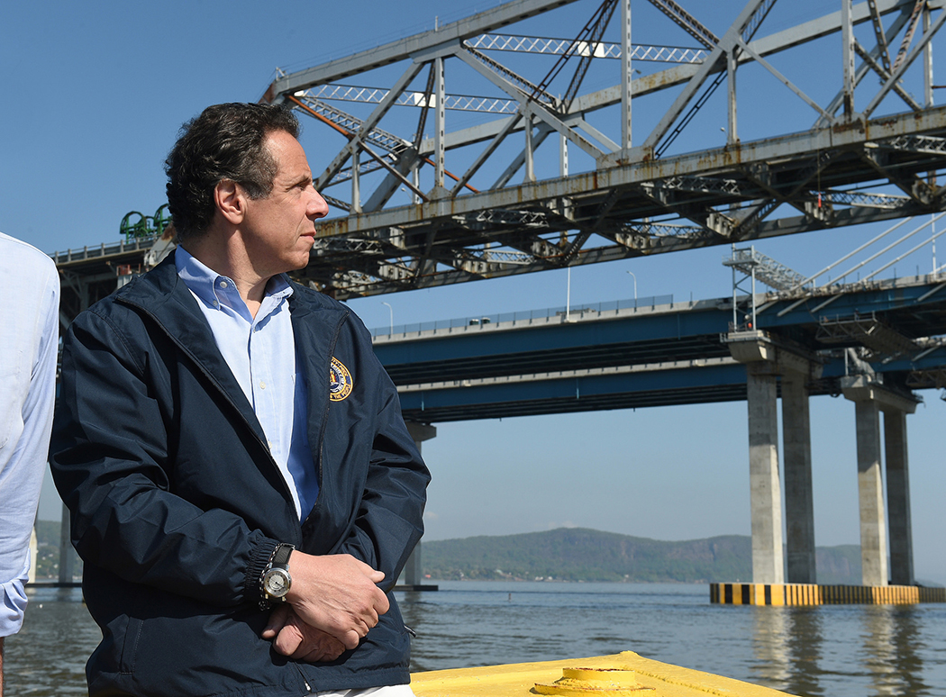 Andrew Cuomo looking at a bridge