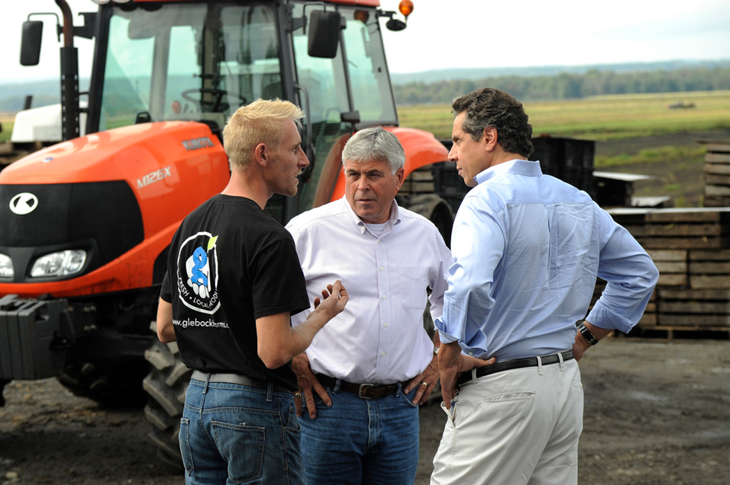 Andrew Cuomo looking at farmers