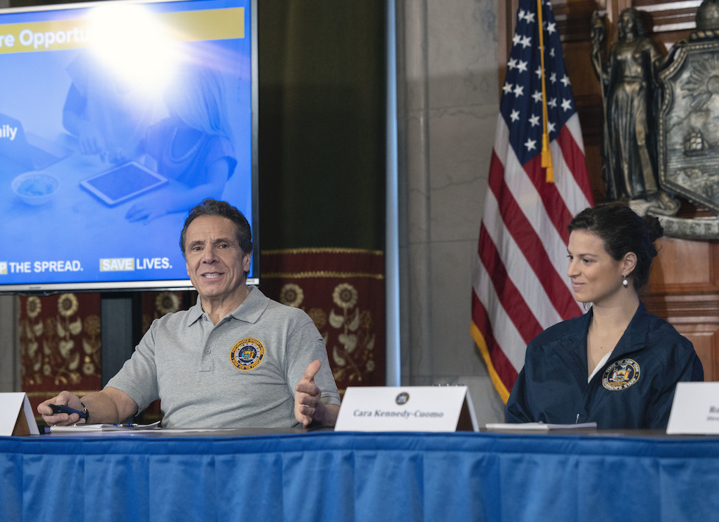 Cara Cuomo next to her father at a coronavirus press conference. 