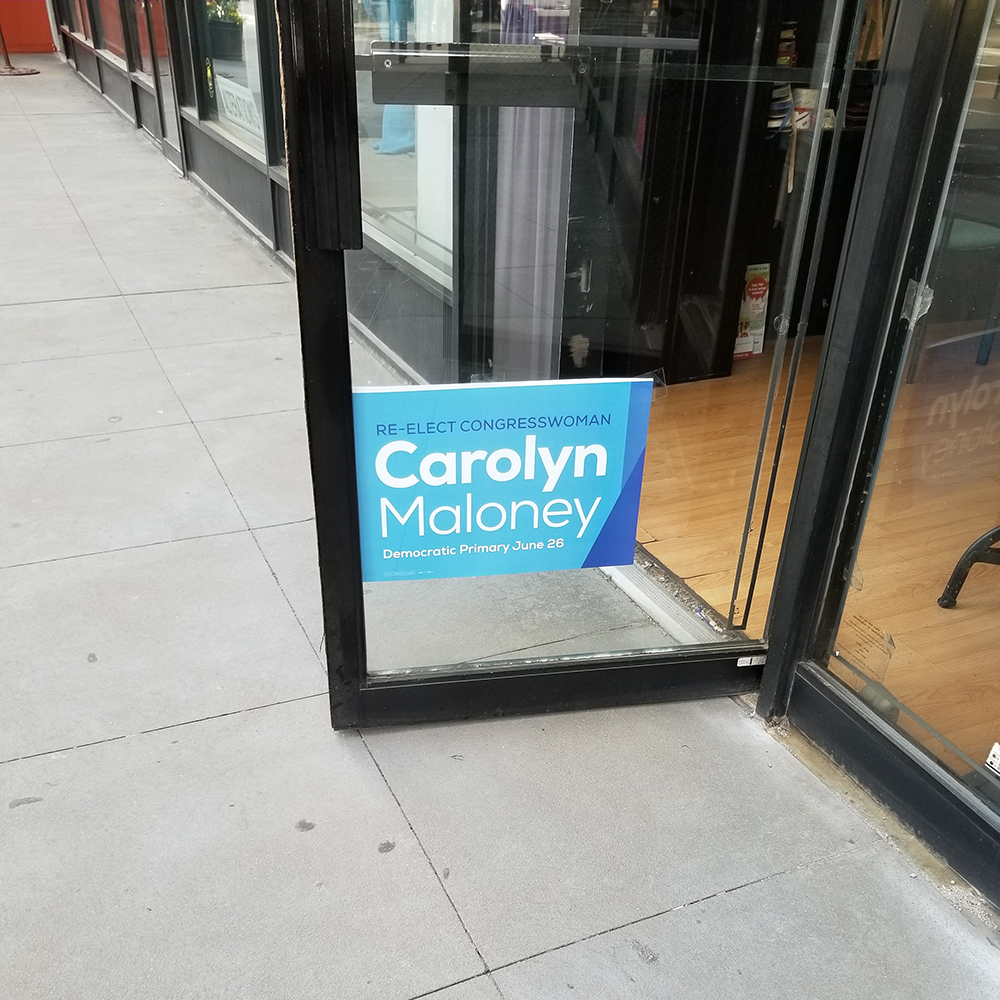 A Carolyn Maloney poster in a dry cleaner on Manhattan's Upper East Side. 