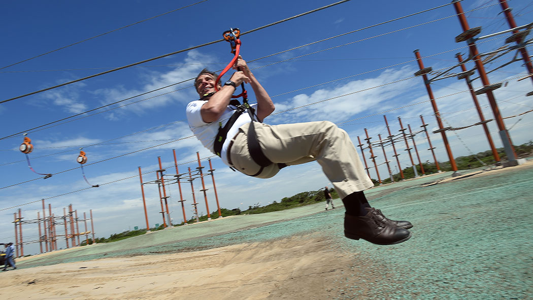 Cuomo taking a ride on the zipline.