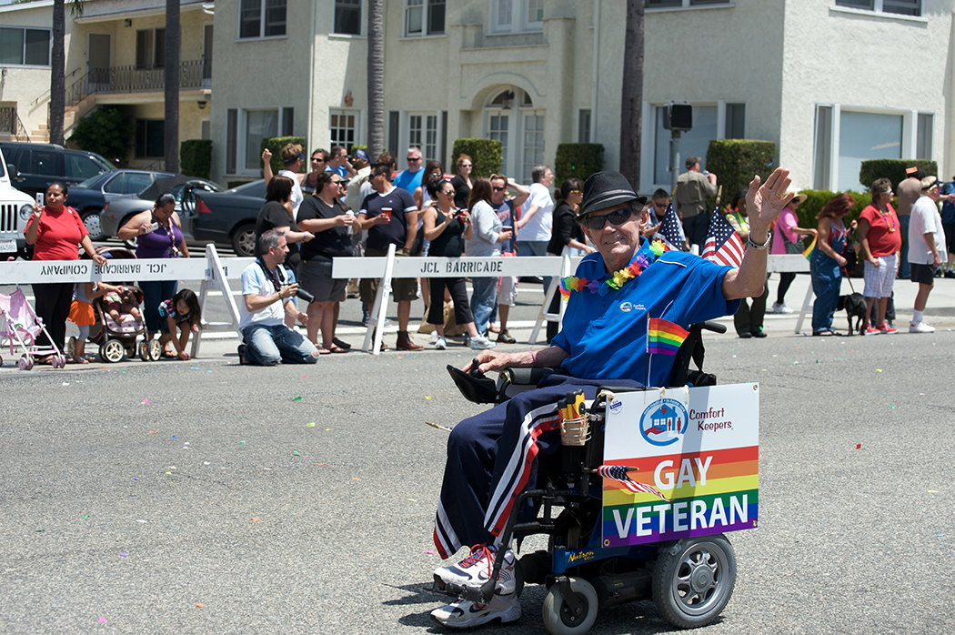 A veteran in a wheelchair during the 2012 Long Beach Lesbian and Gay Pride Parade. A veteran in a wheelchair during the 2012 Long Beach Lesbian and Gay Pride Parade.