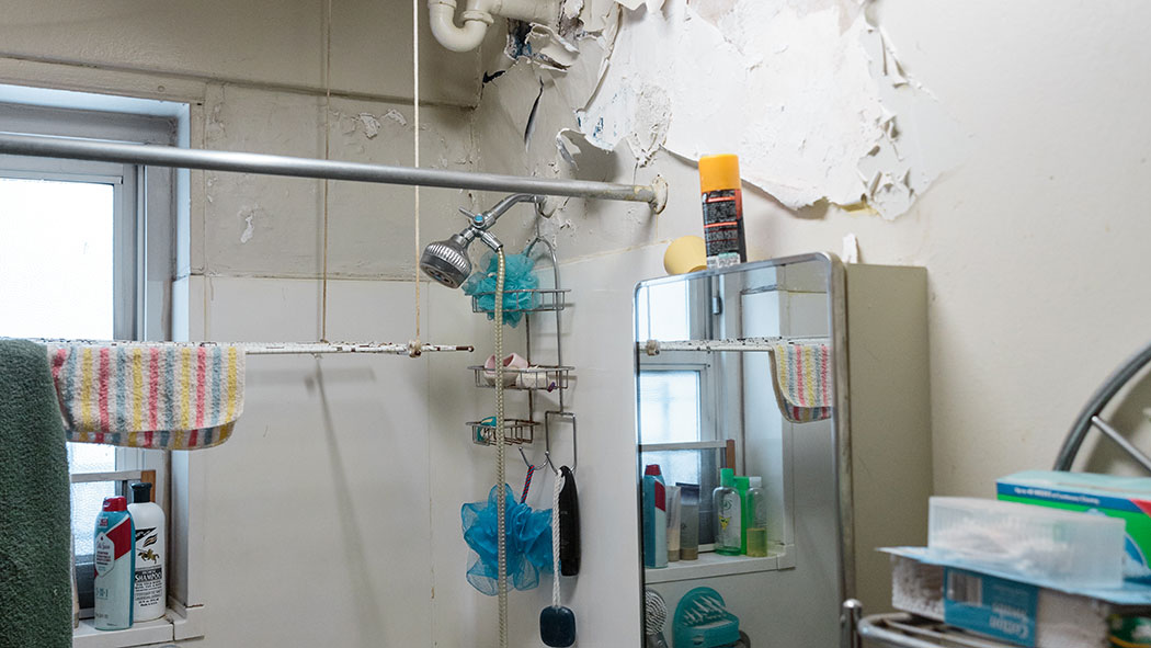 Judith Maldonado's Patterson Houses apartment, visibly suffering from water damage.