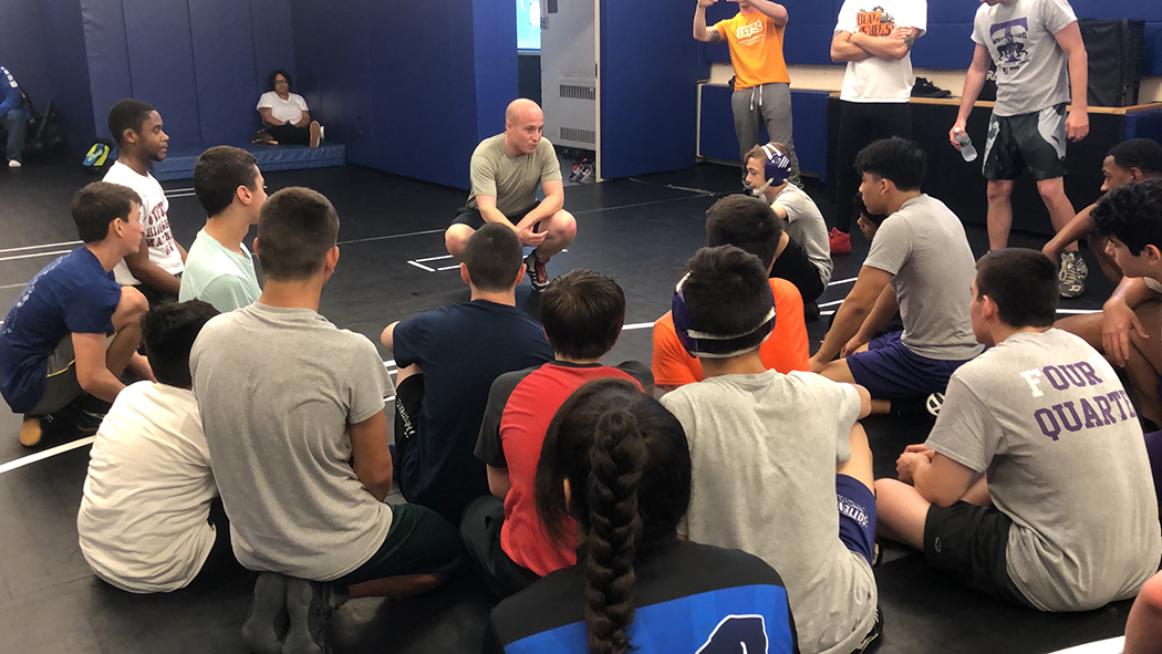 Max Rose talks to a bunch of wrestlers