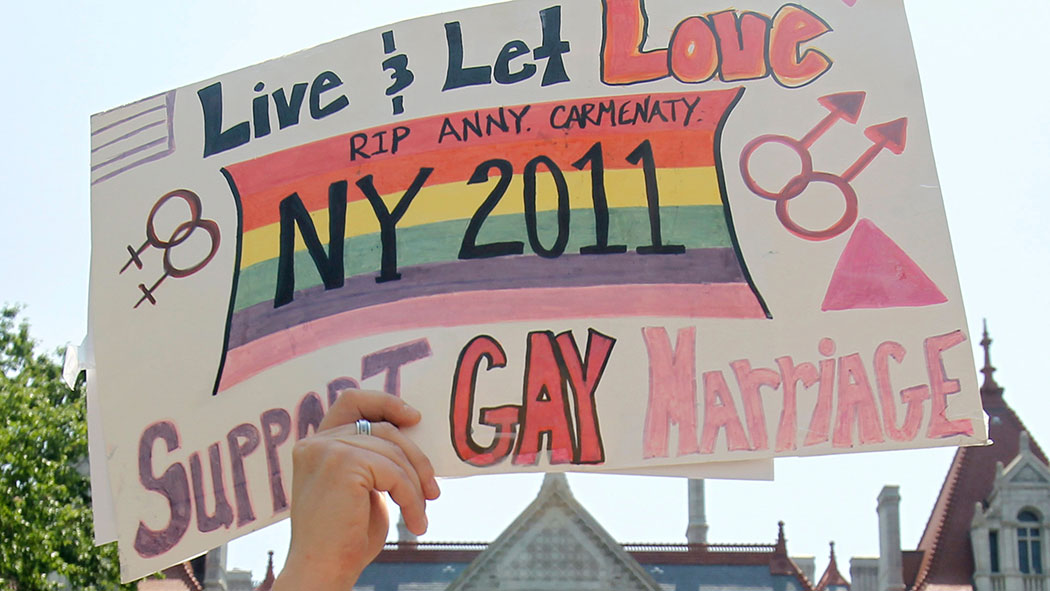 Lisa Gore of Scotia, New York, holds a sign during a marriage equality rally at the Capitol in Albany in 2011.