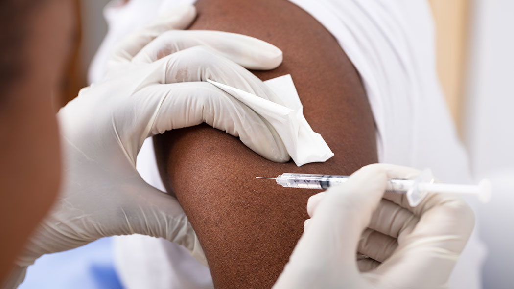 A patient receives a vaccination.