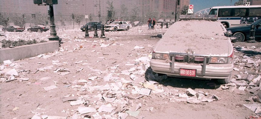 Ash covers an emergency vehicle as it lies near the area known as Ground Zero, following the collapse of the Twin Towers.