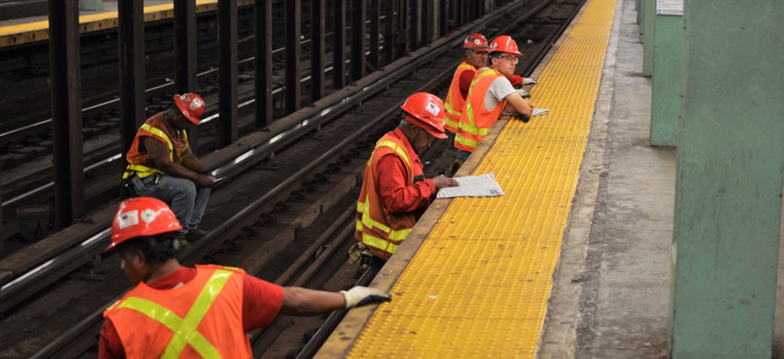 MTA workers repairing subway tracks