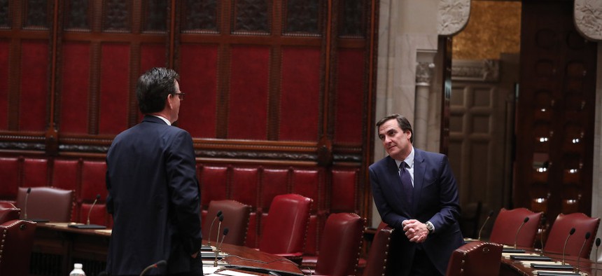 Deputy Majority Leader Senator Michael Gianaris speaks to Senate Minority Leader John J. Flanagan while practicing social distancing in March of this year.