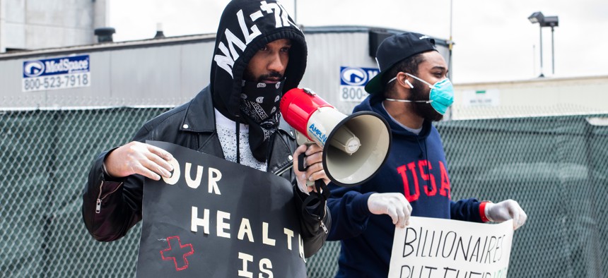 Former Amazon employee Chris Smalls and Amazon employee Jordan Flower at a may day protest in front of the Amazon JFK8 Distribution Center.