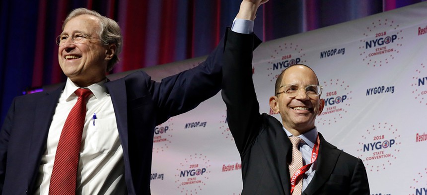 New York Republican State Committee Chairman Ed Cox, left, raises the hand of GOP comptroller candidate Jonathan Trichter at the New York state Republican Convention earlier this year in Manhattan.