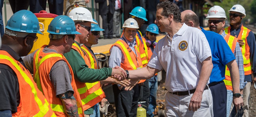 Governor Cuomo shakes hands with MTA construction workers.