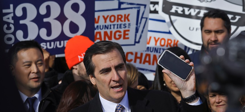 State Sen. Michael Gianaris calls on supporters to remove the Amazon app from their phones as he address a coalition rally in November.