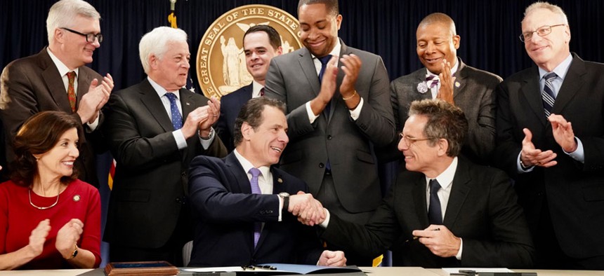 Actor Ben Stiller accompanied Gov. Andrew Cuomo as he signed voter reform legislation.