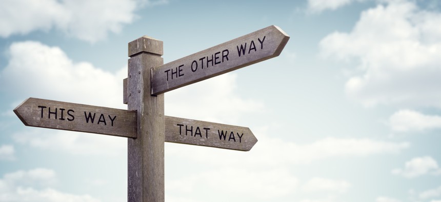 A sign showing lots of different directions