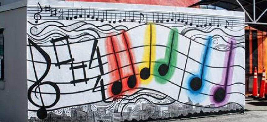 One part of the mural is adorned with the artistic version of Beethoven’s “Ode to Joy” and the New York City skyline.