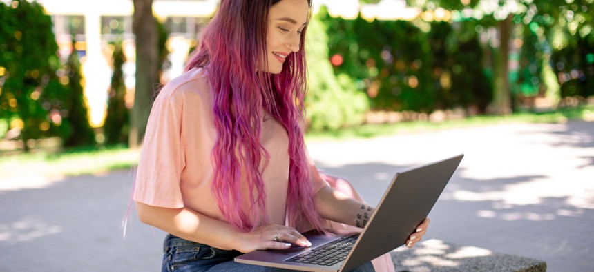 Woman studying something on a computer. Perhaps it's New York housing, hunger or homelessness policy?