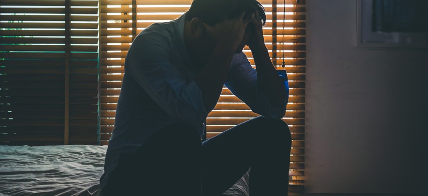 Depressed person on bed might be subject of new report from the CDC.