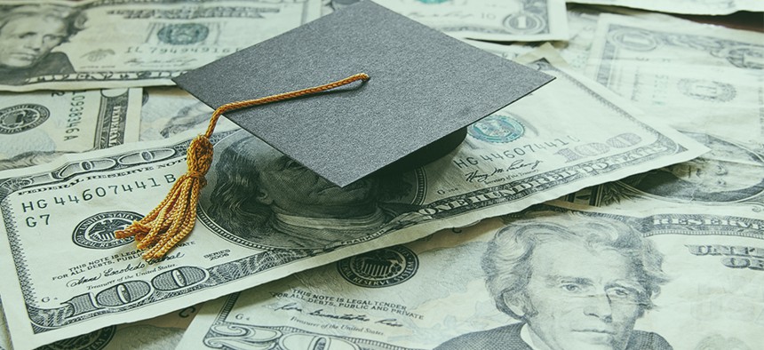 Mortarboard and $20 bills
