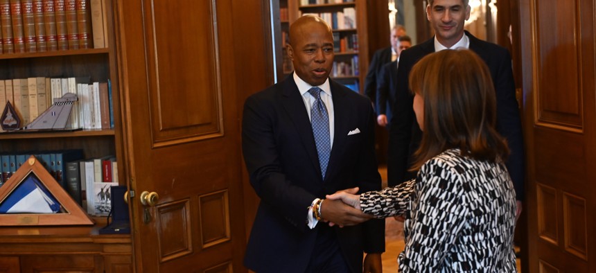 New York City Mayor Eric Adams shakes the hand of President of the Hellenic Republic Katerina Sakellaropoulou while he’s followed by Athens Mayor Kostas Bakoyannis for a meeting in Athens Thursday.