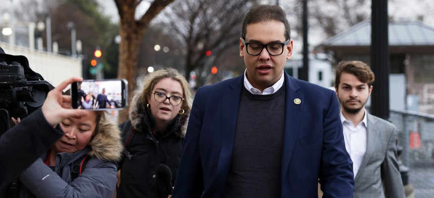 Rep. George Santos leaves the Capitol Hill Club in Washington as members of the press follow him on January 31, 2023.
