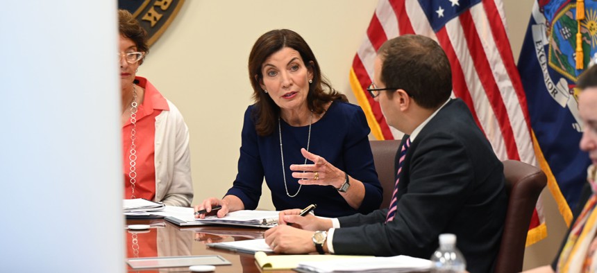 Gov. Kathy Hochul, center, with former Counsel to the Governor Elizabeth Fine, left, and former Director of Policy Micah Lasher