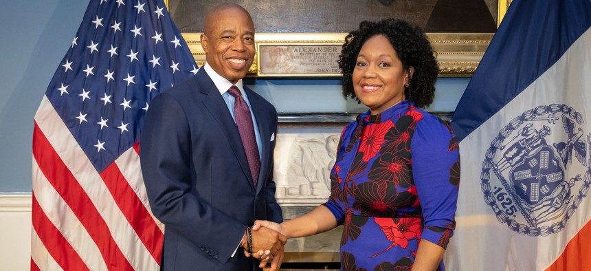 Mayor Eric Adams shakes hands with newly-appointed DOC Commissioner Lynelle Maginley-Liddie.