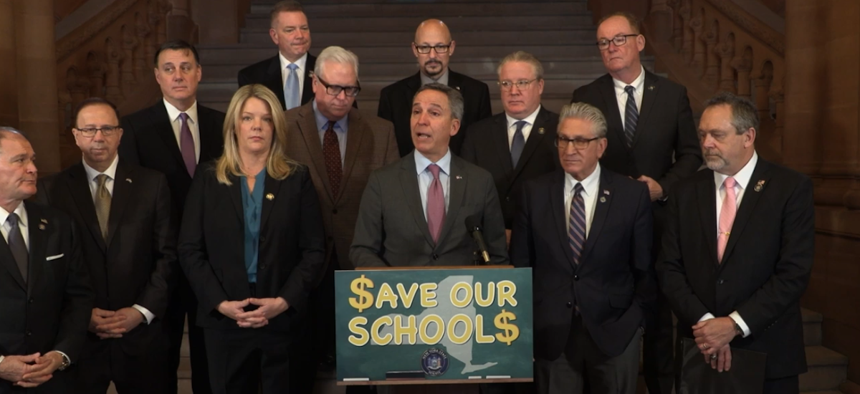 GOP state Sen. Jack Martins speaks at a minority rally against school budget cuts.