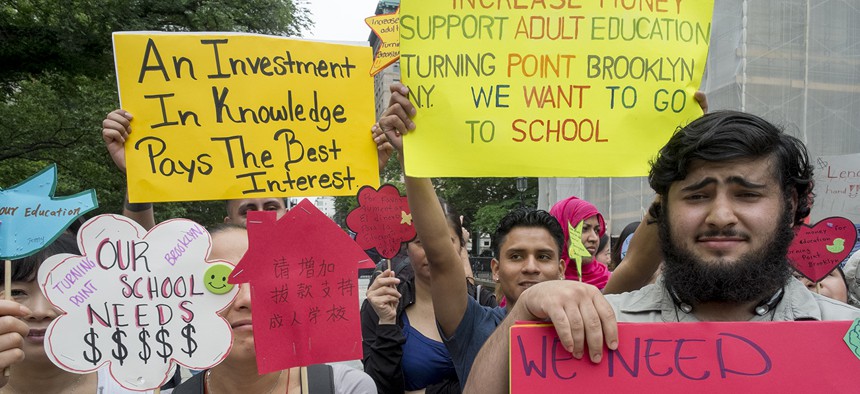 Adult literacy advocates rally during a City Hall press conference in 2014.