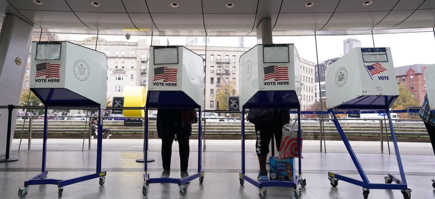 Voters cast their ballots at a polling place in the Brooklyn Museum on Nov. 1, 2022.