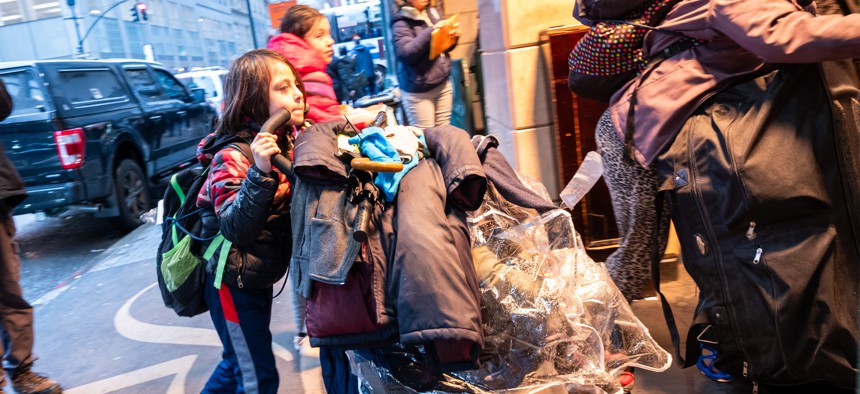 Migrant families check into a processing center at the Roosevelt Hotel in midtown Manhattan Jan. 09, 2024.