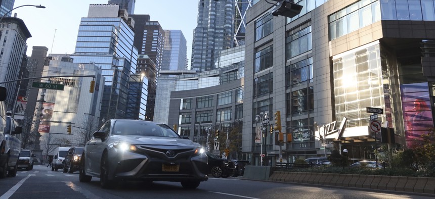Congestion pricing toll readers hang above Broadway at Columbus Circle on November 30, 2023, in New York City.