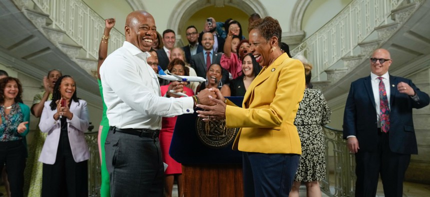 Mayor Eric Adams presented City Council Speaker Adrienne Adams with a model airplane to mark a budget agreement.