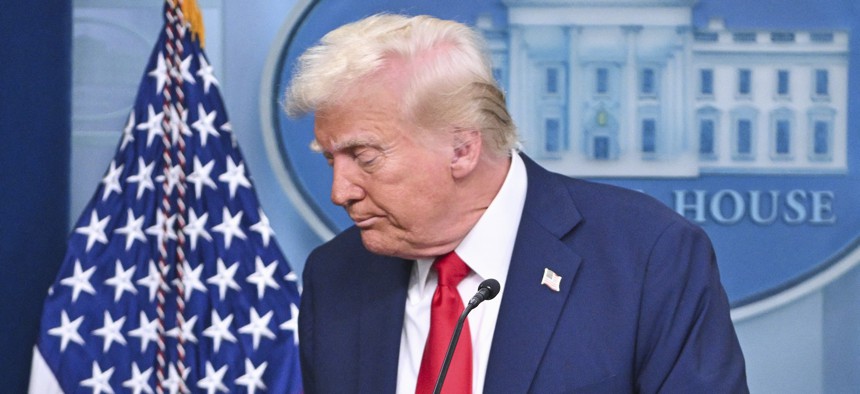 Donald Trump leaves the podium in the White House press room after delivering a briefing on the collision of an American Airlines jet and U.S. Army helicopter on Jan. 30.