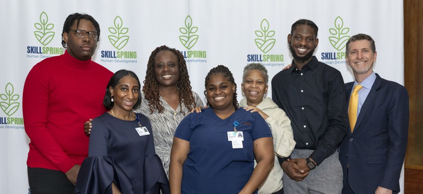 State Sen. Cordell Cleare (third from left) and The New Jewish Home President and CEO Dr. Jeffrey Farber (far right) pose with a resident of The New Jewish Home and leaders and participants of the SkillSpring program, which trains young adults from underserved communities to become certified nursing assistants.