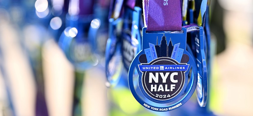 The 2024 United Airlines NYC Half Marathon medal ribbon.