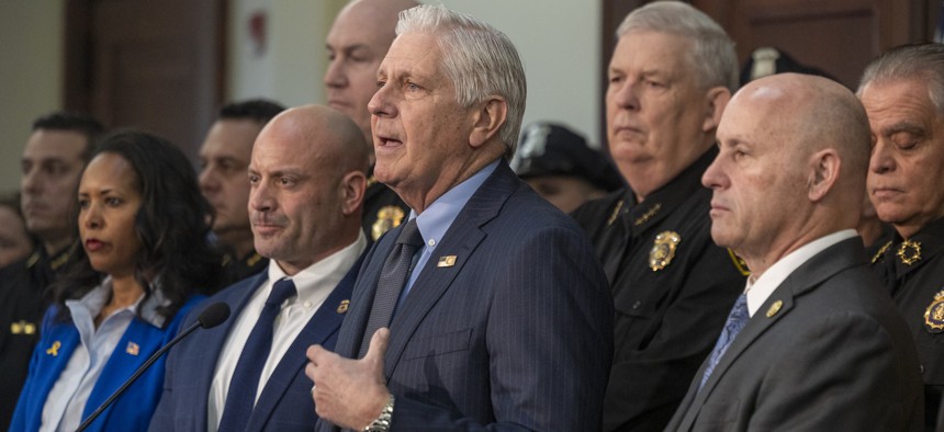 Nassau County Executive Bruce Blakeman, center, announces new ICE enforcement measures, alongside ICE Special Agent Brian Flanagan, left, and Nassau County Police Commissioner Patrick Ryder, right, on Feb. 4, 2025.