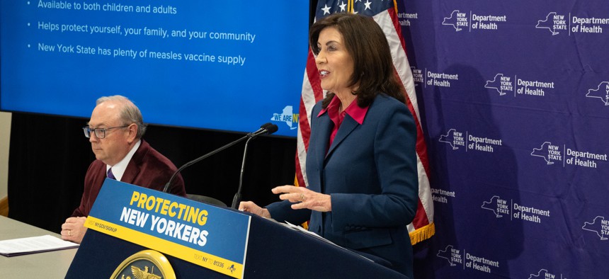 Gov. Kathy Hochul and state Health Department Commissioner James McDonald, left, speak at a press conference about measles cases in New York state on March 19.