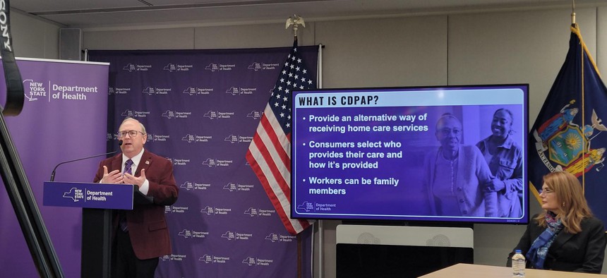 State Health Commissioner James McDonald, left, and Public Partnerships LLC President Maria Perrin hold a press conference about the troubled CDPAP transition, on March 24, 2025.