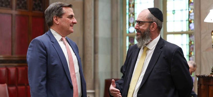 State Sen. Simcha Felder, right, speaks with state Senate Deputy Majority Leader Michael Gianaris.
