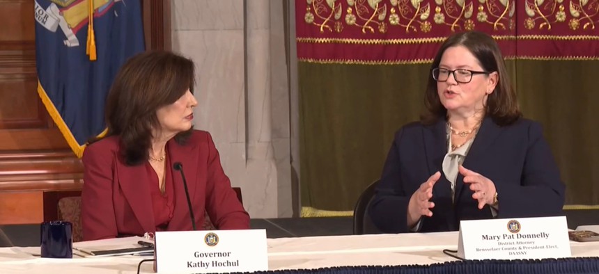 Rensselaer County District Attorney Mary Pat Donnelly, right, speaks to Gov. Kathy Hochul.