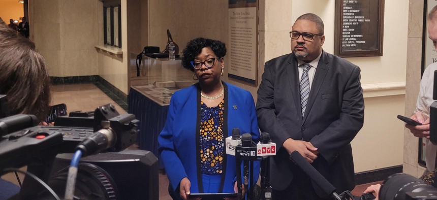 Bronx District Attorney Darcel Clark and Manhattan District Attorney Alvin Bragg speak to reporters at the state Capitol on April 7, 2025.
