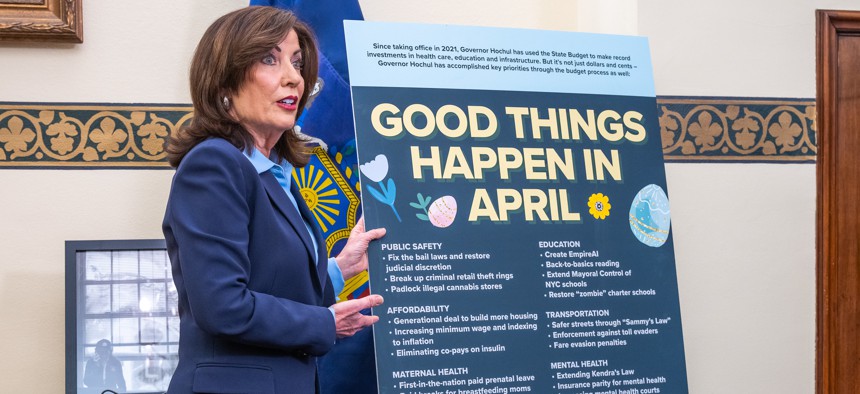 Gov. Kathy Hochul points to a list of policies included in the state budget since she took office in 2021. During her time as governor, New York has never had an on-time budget.