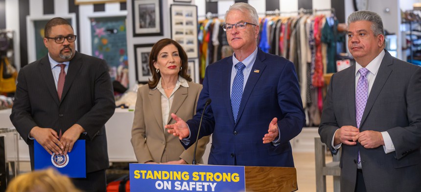 Staten Island District Attorney Michael Mahon speaks to reporters about the discovery law, flanked by Manhattan District Attorney Alvin Bragg, Gov. Kathy Hochul and Brooklyn District Attorney Eric Gonzalez.