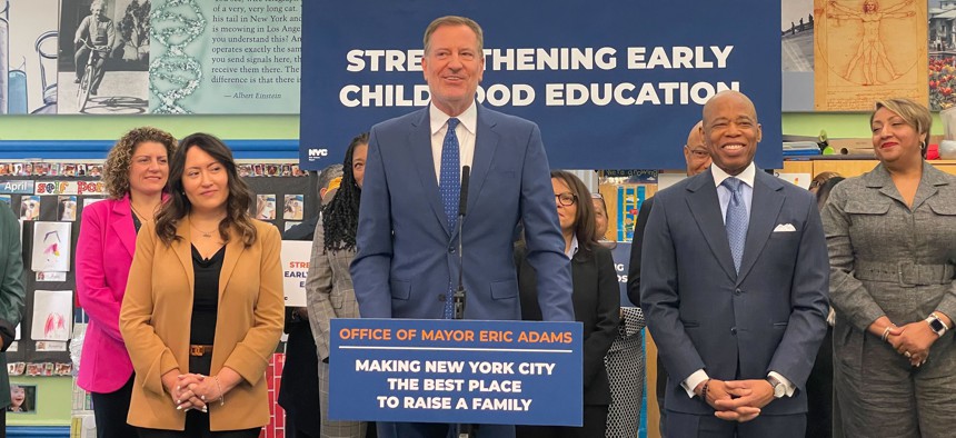 Former Mayor Bill de Blasio, center, joined Mayor Eric Adams for an early childhood education announcement.